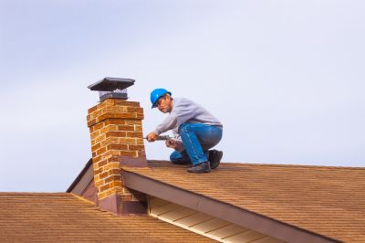 Professional Securing a Chimney Cap